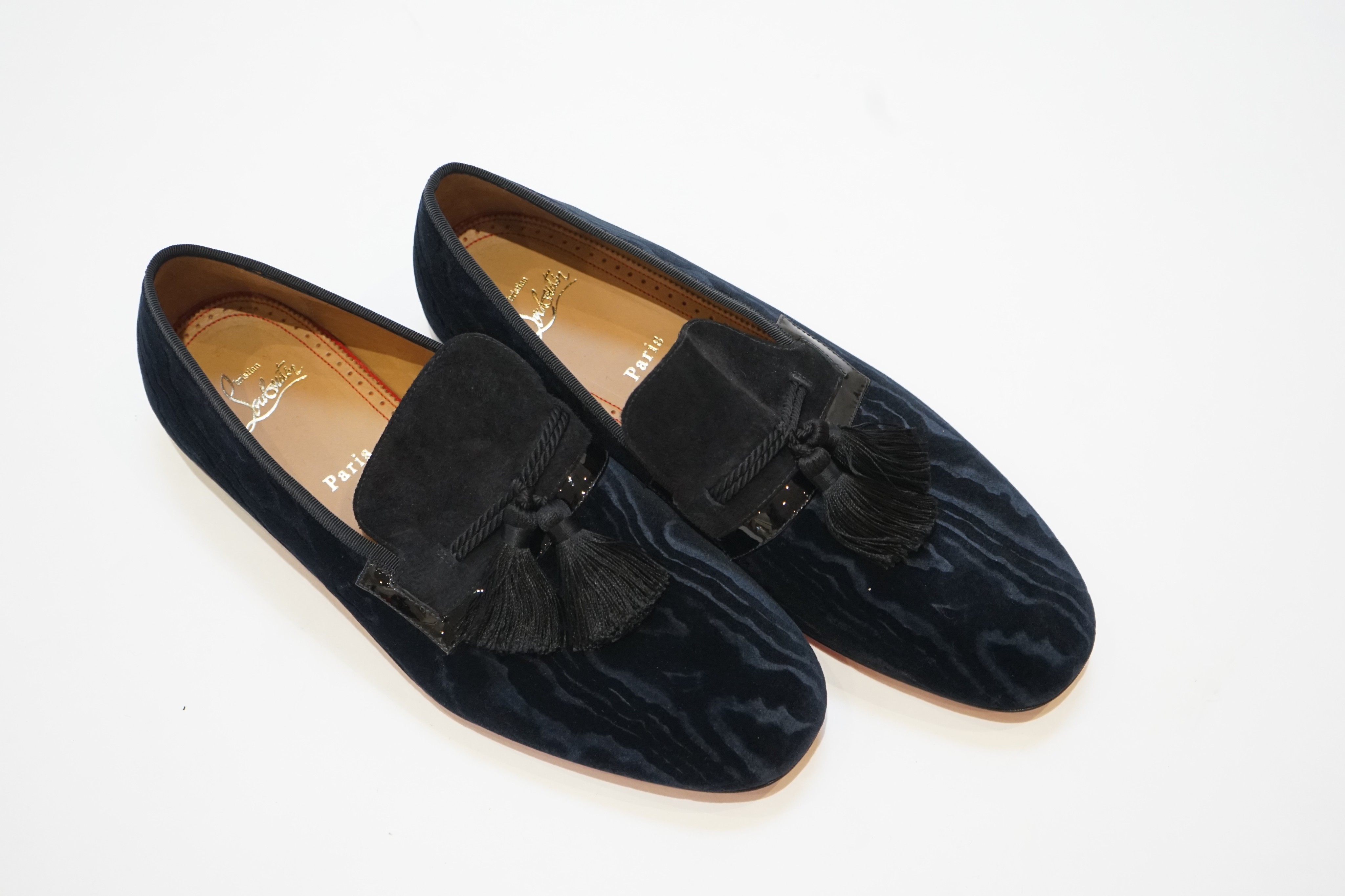 A pair of gentleman's Christian Louboutin navy blue watered velvet and suede evening slippers with black tassels (unworn), size 42.5, in bag